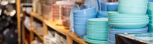 Closeup of variety dishes, bowls and other goods for kitchen at a decor store