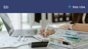 worker with a stack of documents and a laptop