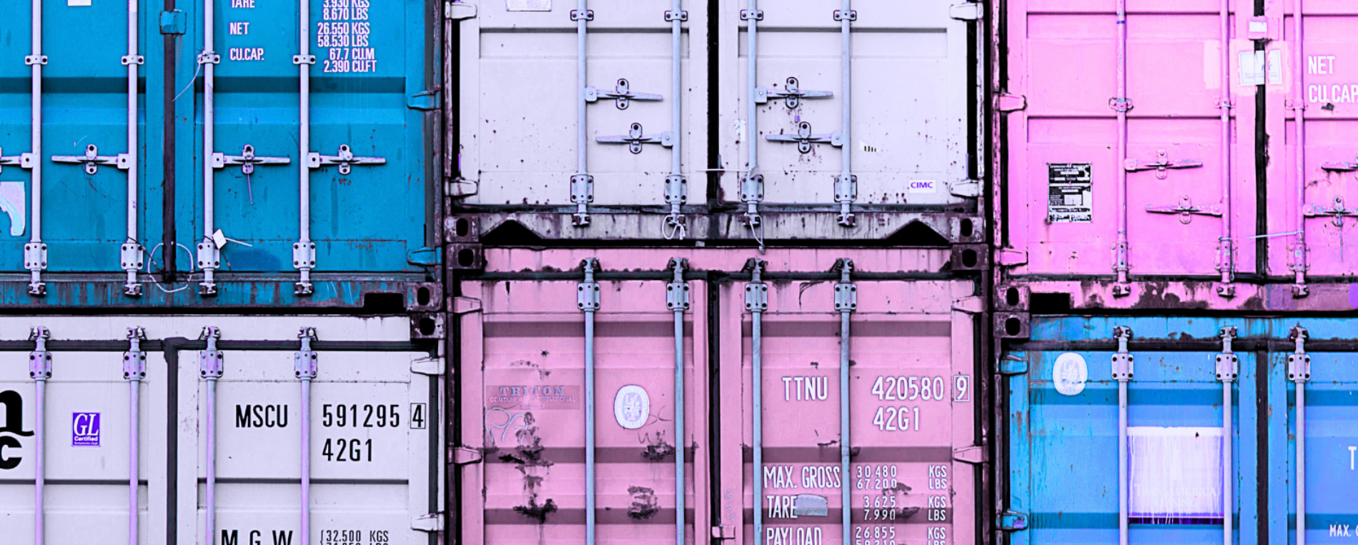 shipping containers of different colors stacked on top of each other